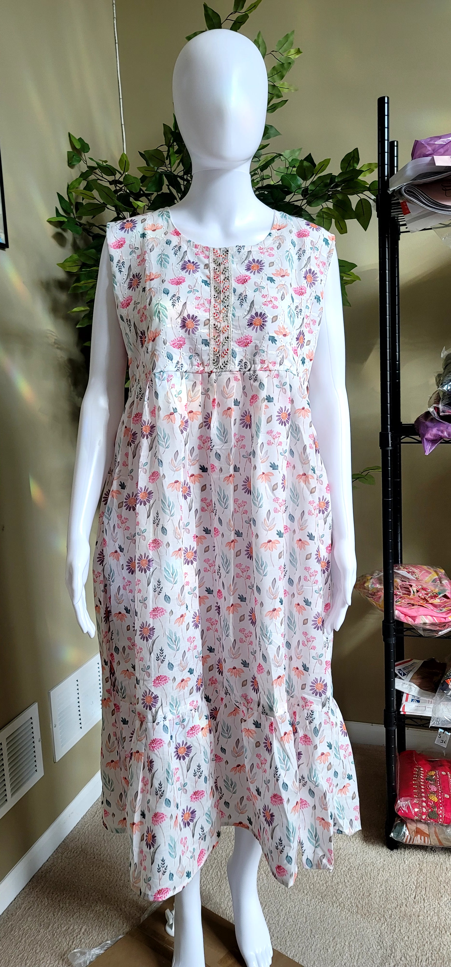 White floral sleeveless cotton knee-length frock gown top front